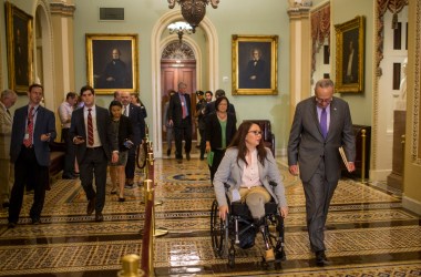 Senator Tammy Duckworth and Senate Minority Leader Chuck Schumer head to a weekly news conference on Capitol Hill in Washington, D.C., on August 21st, 2018.